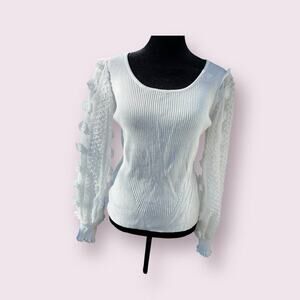 White sweater with sheer tufted sleeves.  Women's size 7-9
